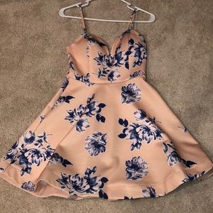 Cream thin strapped dress with blue flowers.